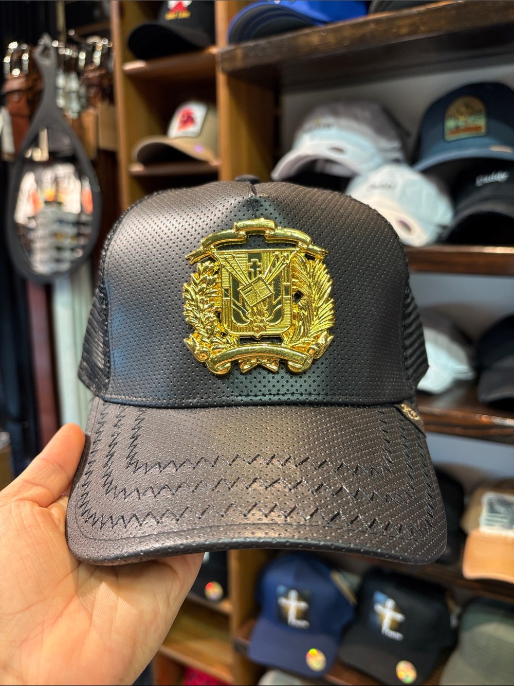Black Perforated Trucker Hat with Gold Crest Accent